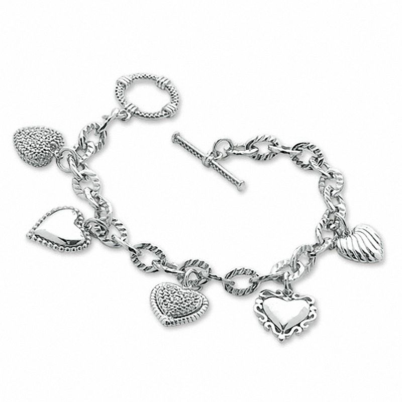 1/5 Ct. T.W. Diamond Heart Assorted Charm Bracelet in Sterling Silver