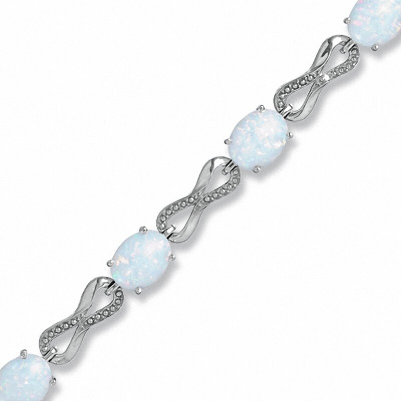 Main Image 1 of Oval Lab-Created Opal and Diamond Knot Bracelet in Sterling Silver - 7.25"