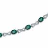 Thumbnail Image 1 of Oval Lab-Created Emerald and Diamond Accent Knot Bracelet in Sterling Silver - 7.25&quot;