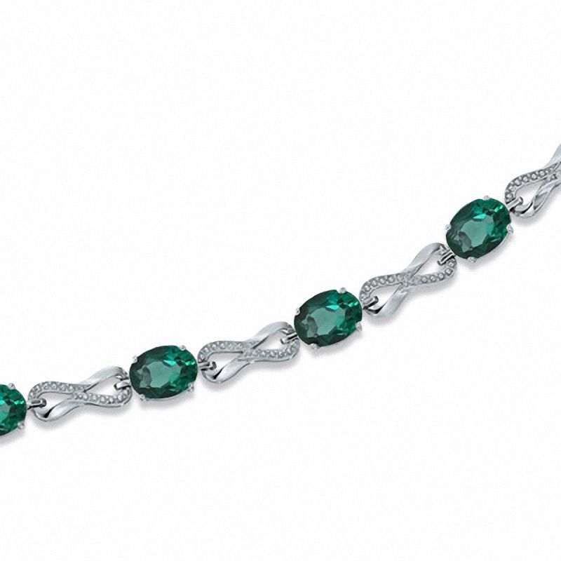 Main Image 1 of Oval Lab-Created Emerald and Diamond Accent Knot Bracelet in Sterling Silver - 7.25&quot;