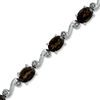 Thumbnail Image 1 of Oval Smoky Quartz and Diamond Accent Swirl Bracelet in Sterling Silver - 7.25"