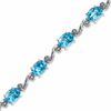 Thumbnail Image 0 of Oval Blue Topaz and Diamond Accent Bracelet in Sterling Silver - 7.25"