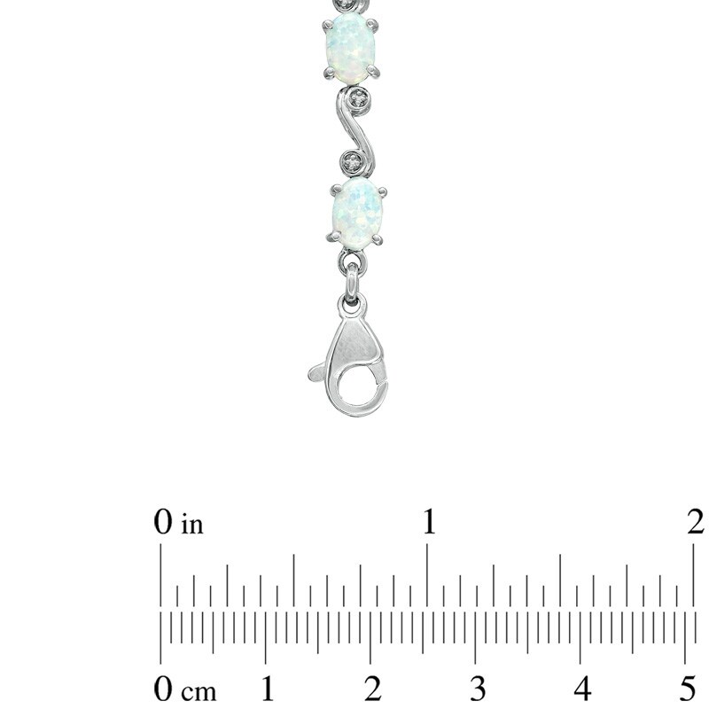 Oval Lab-Created Opal and Diamond Accent Swirl Bracelet in Sterling Silver - 7.25"