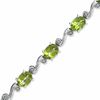 Thumbnail Image 1 of Oval Peridot and Diamond Accent Bracelet in Sterling Silver - 7.25&quot;