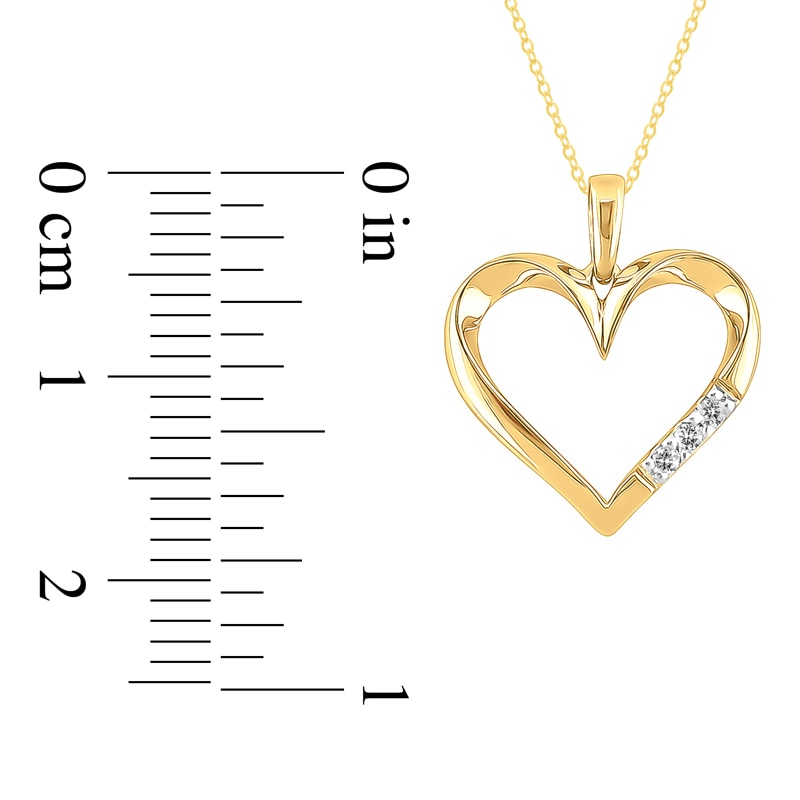 1/20 CT. T.W. Diamond Three Stone Heart Pendant in 10K Gold