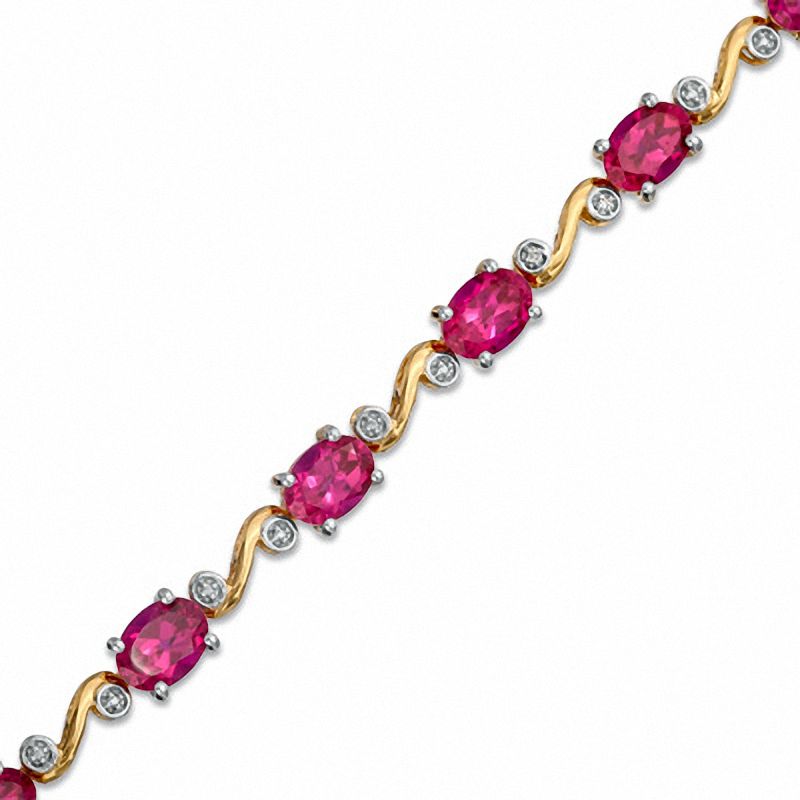 Main Image 1 of Oval Lab-Created Ruby and Diamond Accent Swirl Bracelet in Sterling Silver with 14K Gold Plate - 7.25"