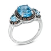 Thumbnail Image 1 of Oval Swiss Blue Topaz and Garnet Frame Ring in Sterling Silver