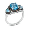 Thumbnail Image 1 of Oval Swiss Blue Topaz and Garnet Frame Ring in Sterling Silver