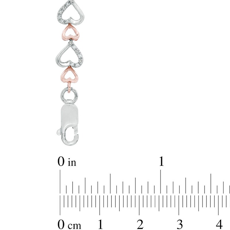 Main Image 2 of 1/3 CT. T.W. Diamond Fluttering Hearts Bracelet in Sterling Silver and 10K Rose Gold
