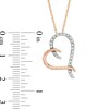 Thumbnail Image 2 of 1/5 CT. T.W. Diamond Tilted Ribbon Heart Pendant in 10K Rose Gold