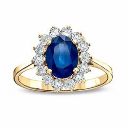 Oval Blue Sapphire and 1/3 CT. T.W. Diamond Engagement Ring in 14K Gold