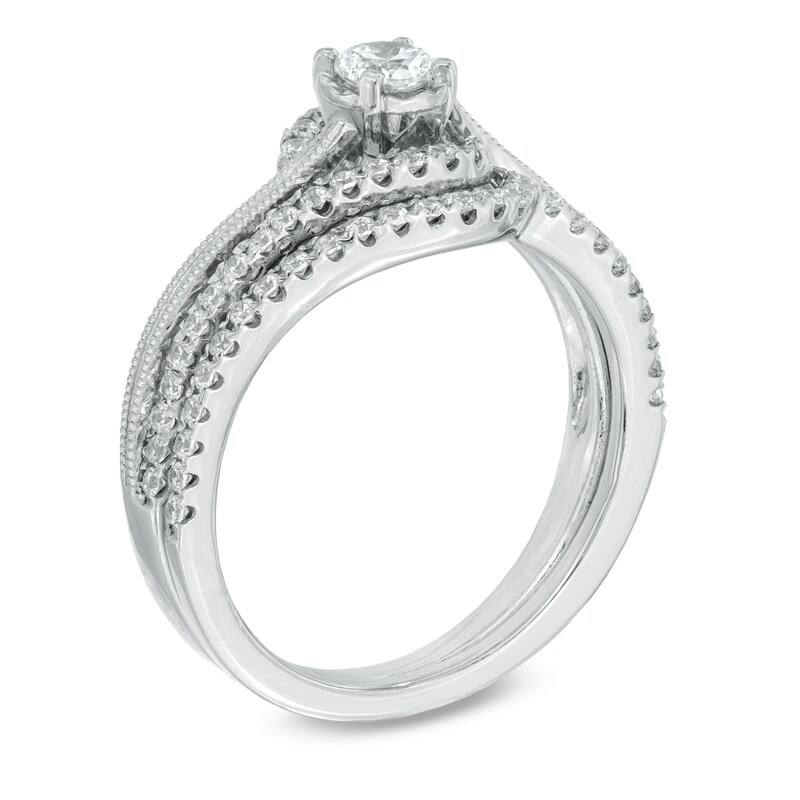 1/2 CT. T.W. Diamond Milgrain Swirl Frame Bridal Set in 10K White Gold