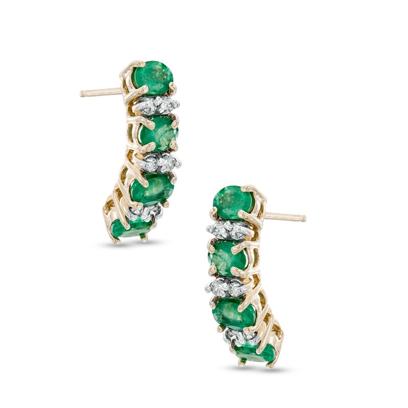 Oval Emerald and 1/8 CT. T.W. Diamond Drop Earrings in 14K Gold