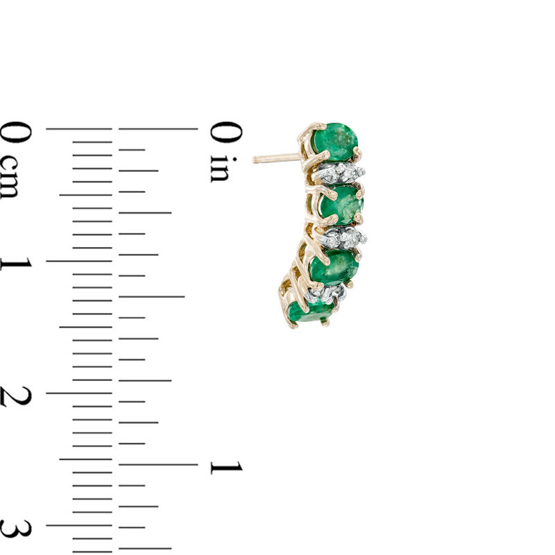 Oval Emerald and 1/8 CT. T.W. Diamond Drop Earrings in 14K Gold
