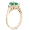 Thumbnail Image 1 of Oval Emerald and 1/5 CT. T.W. Diamond Ring in 14K Gold