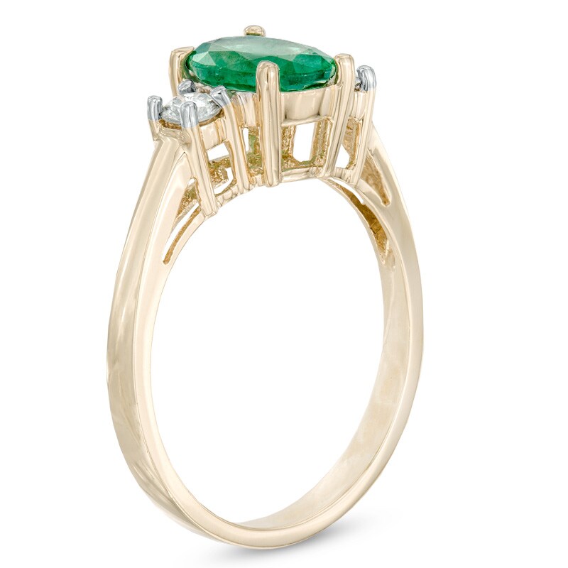 Oval Emerald and 1/5 CT. T.W. Diamond Ring in 14K Gold