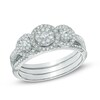 Thumbnail Image 0 of 1/2 CT. T.W. Diamond Frame Three Stone Cluster Three Piece Bridal Set in 10K White Gold