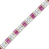 Thumbnail Image 0 of Baguette Lab-Created Ruby and White Sapphire Line Bracelet in Sterling Silver with 14K Gold Plate - 7.25"