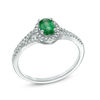 Oval Emerald and 1/6 CT. T.W. Diamond Frame Ring in 10K White Gold