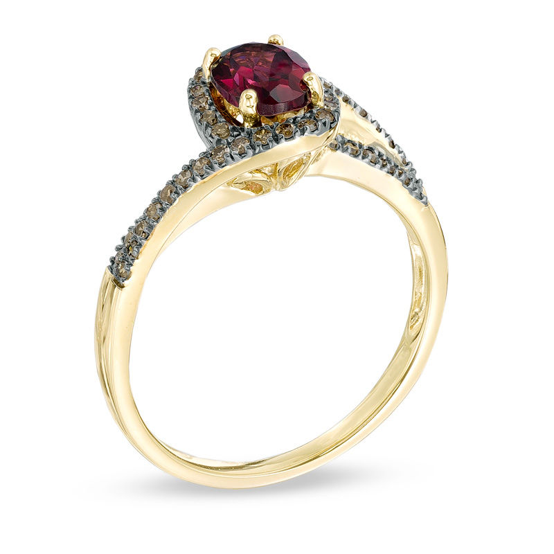 Oval Rhodolite Garnet and 1/5 CT. T.W. Champagne Diamond Ring in 10K Gold