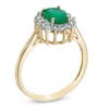 Thumbnail Image 1 of Oval Emerald and 1/5 CT. T.W. Diamond Frame Ring in 14K Gold