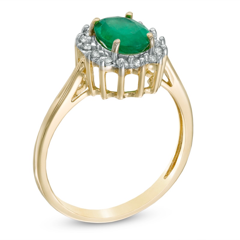 Oval Emerald and 1/5 CT. T.W. Diamond Frame Ring in 14K Gold