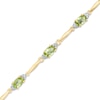 Thumbnail Image 1 of Oval Peridot and Diamond Accent Bracelet in Sterling Silver and 10K Gold Plate - 7.25"