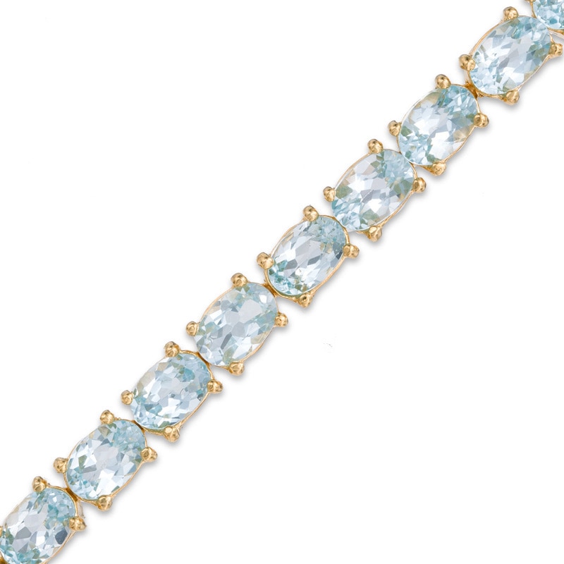 Main Image 1 of Oval Blue Topaz Fashion Bracelet in Sterling Silver and 18K Gold Plate - 7.5"