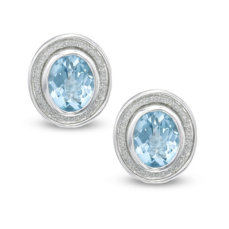 Oval Blue Topaz Glitter Stud Earrings in Sterling Silver