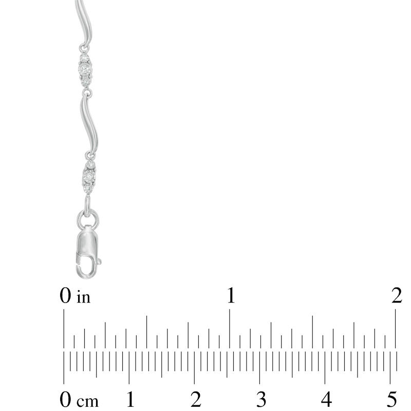 Main Image 2 of 1/8 CT. T.W. Diamond Three Stone Curved Station Bracelet in 10K White Gold