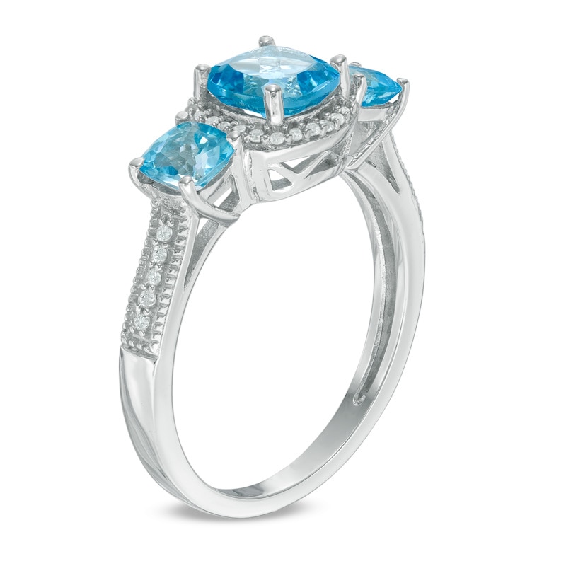 6.0mm Cushion-Cut Blue Topaz and Lab-Created White Sapphire Frame Three Stone Ring in Sterling Silver