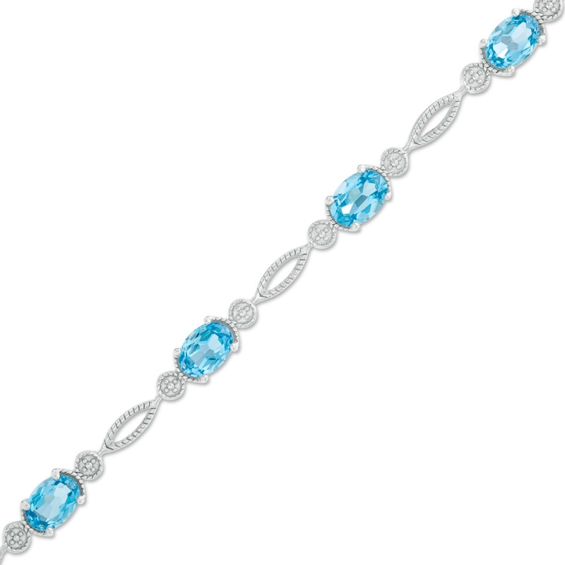 Main Image 1 of Oval Swiss Blue Topaz Rope Bracelet in Sterling Silver - 7.5"