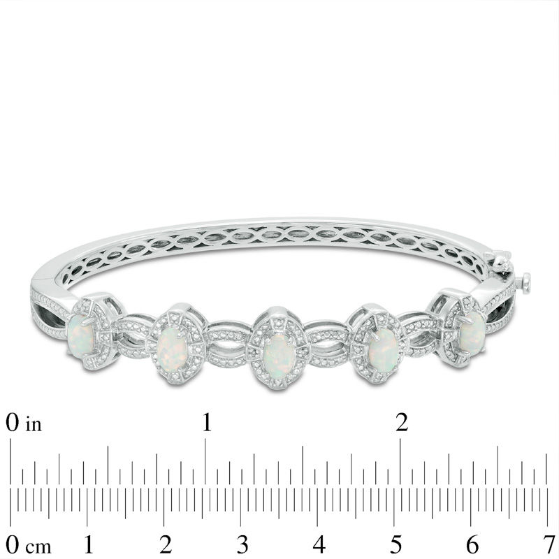 Oval Lab-Created Opal and Diamond Accent Bangle in Sterling Silver,  7.5