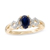 Thumbnail Image 0 of Oval Lab-Created Blue and White Sapphire Twist Ring in 10K Gold