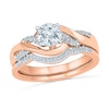 Thumbnail Image 1 of Lab-Created White Sapphire and 1/10 CT. T.W. Diamond Twist Bridal Set in 10K Rose Gold