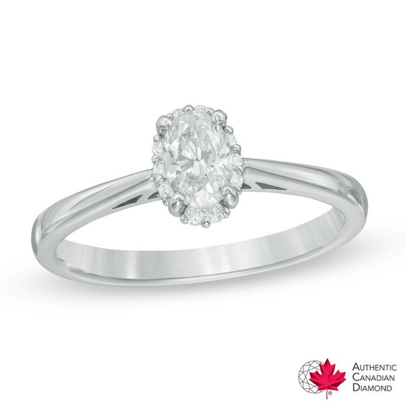 5/8 CT. T.W. Certified Canadian Oval Diamond Frame Engagement Ring in 14K Gold (I/I2)