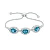 Thumbnail Image 1 of Oval London Blue Topaz and Lab-Created White Sapphire Frame Three Stone Bolo Bracelet in Sterling Silver - 9.0"