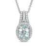 Thumbnail Image 1 of Oval Aquamarine and 1/10 CT. T.W. Diamond Frame Pendant in Sterling Silver