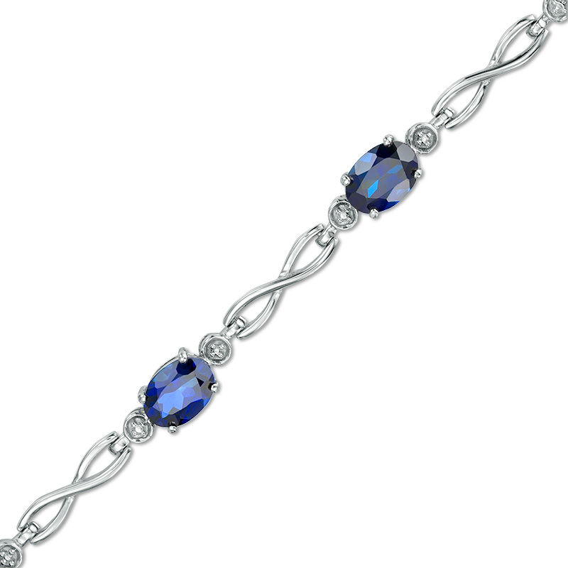 Main Image 1 of Oval Lab-Created Ceylon Sapphire Infinity Link Bracelet in Sterling Silver - 7.25"