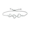 Thumbnail Image 0 of 1/20 CT. T.W. Diamond Triple Heart Bolo Bracelet in Sterling Silver - 9.5"