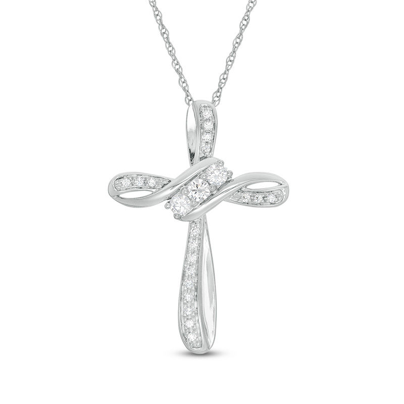Main Image 1 of 1/4 CT. T.W. Diamond Three Stone Bypass Cross Pendant in 10K White Gold
