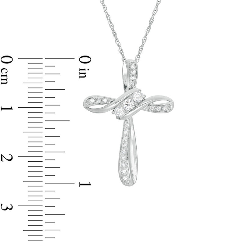 Main Image 2 of 1/4 CT. T.W. Diamond Three Stone Bypass Cross Pendant in 10K White Gold
