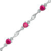 Thumbnail Image 0 of 5.0mm Heart-Shaped Lab-Created Ruby and Diamond Accent Bypass Link Bracelet in Sterling Silver - 7.25"