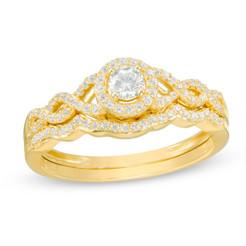 3/8 CT. T.W. Diamond Frame Twist Bridal Set in 10K Gold