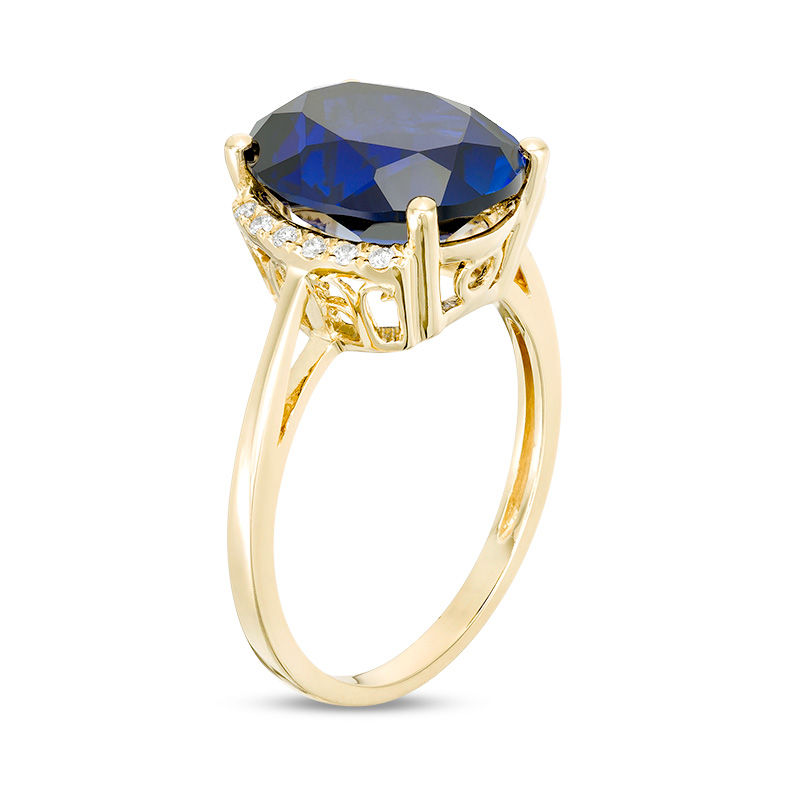 Main Image 2 of Oval Lab-Created Blue Sapphire and 1/20 CT. T.W. Diamond Collared Ring in 10K Gold