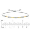 Thumbnail Image 1 of 1/4 CT. T.W. Diamond Three Stone Alternating Concave Link Bolo Bracelet in 10K Two-Tone Gold - 9.9"