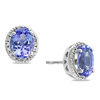Thumbnail Image 1 of EFFY™ Collection Oval Tanzanite and 1/8 CT. T.W. Diamond Frame Stud Earrings in 14K White Gold