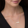 Thumbnail Image 1 of 1/15 CT. T.W. Diamond Double Heart Cut-Out Bar Necklace in Sterling Silver with 14K Gold Plate (1 Line)