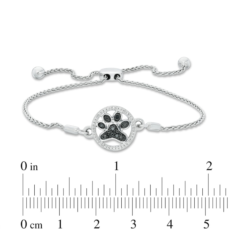 1/20 CT. T.W. Enhanced Black and White Diamond Paw Print Bolo Bracelet in Sterling Silver - 9.5"