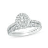 Thumbnail Image 0 of 1/2 CT. T.W. Composite Oval Diamond Double Frame Bridal Set in 10K White Gold